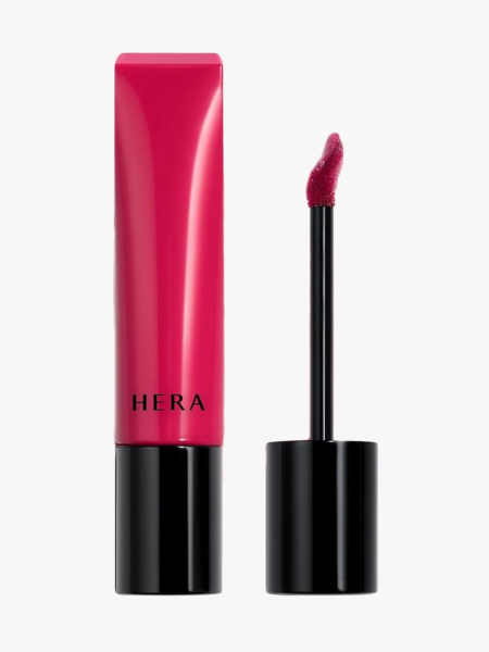 Hera Sensual Tinted Shine Lip Serum in branded components on a light gray background